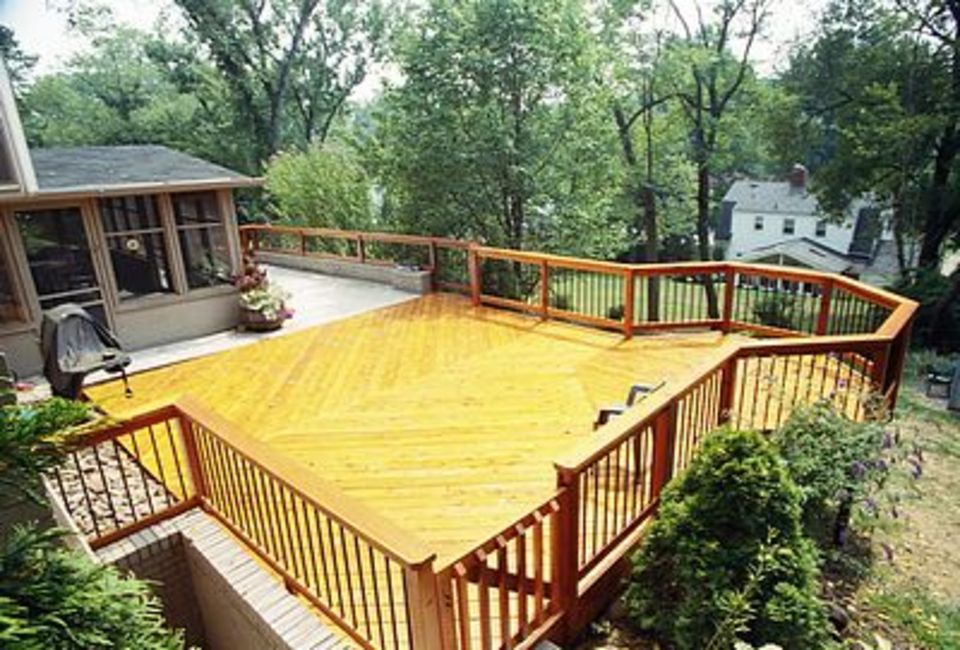 A Wide Deck With Wooden Hand Rails